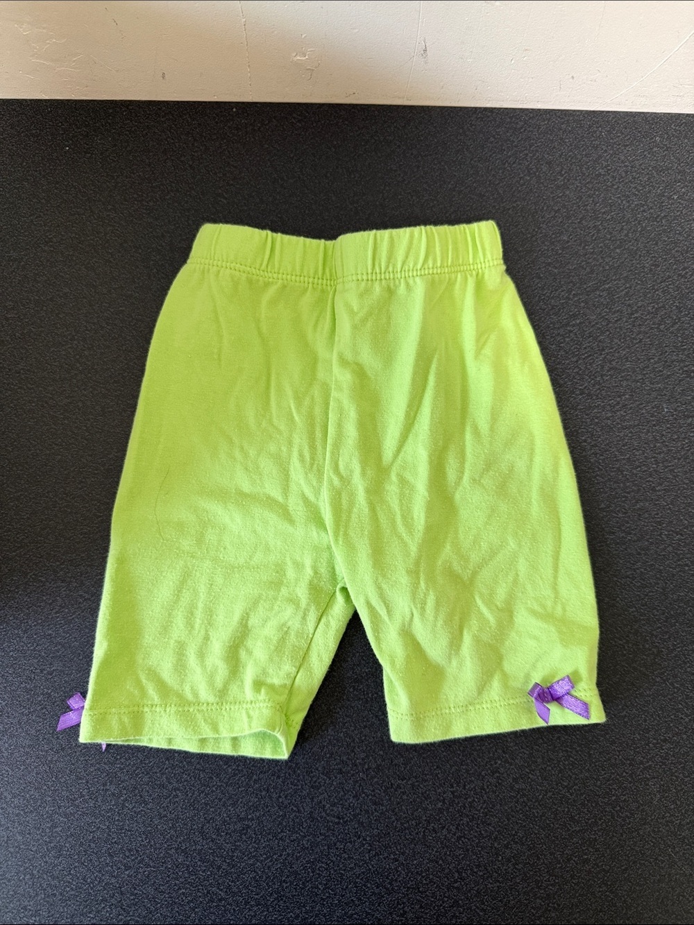 Kids Lime Green Stretch Short Leggings with Purple Bow Accents dated 2014 Y2K